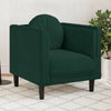 Fauteuil vert foncé en velours avec coussin rond dans un salon
