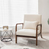 Fauteuil salon ergonomique beige avec coussin lombaire près d'une fenêtre et d'une table d'appoint
