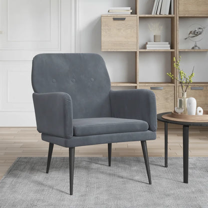 Fauteuil velours gris anthracite près d'une table d'appoint dans un salon