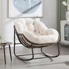 Fauteuil à bascule cocooning Loctudy velours côtelé crème dans un salon