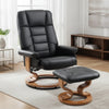 Fauteuil avec pouf Erquy en simili cuir noir dans un salon lumineux