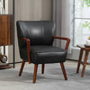 Fauteuil design cuir Lorient noir accoudoirs bois acajou dans un salon