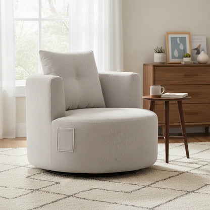 Fauteuil pivotant confort blanc près d'une fenêtre et d'une commode en bois
