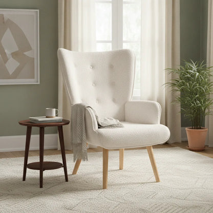 Fauteuil en tissu bouclette blanc avec plaid, près d'une plante verte