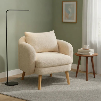 Fauteuil teddy pieds bois massif dans un coin lecture