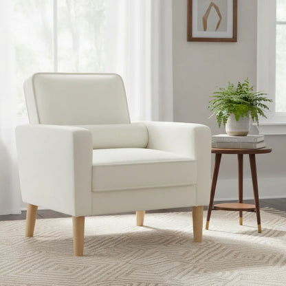Fauteuil crème avec coussin lombaire dans un coin lecture