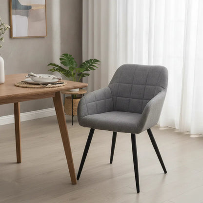 Fauteuil salle à manger confortable gris perle près d'une table ronde