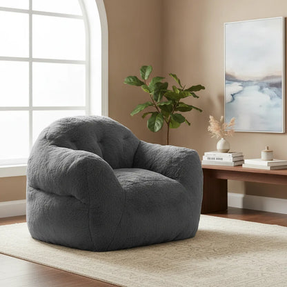 Pouf géant gris foncé dans un salon lumineux